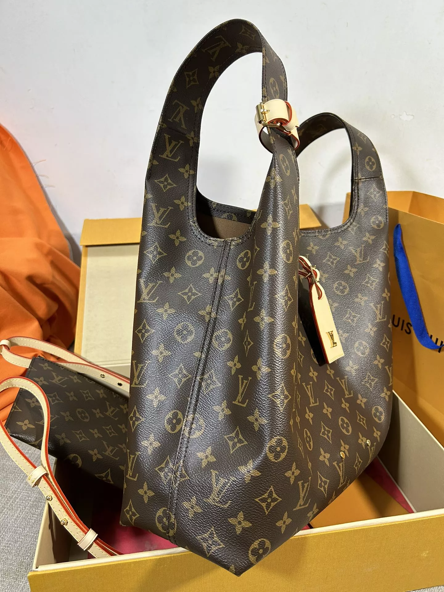 Louis Vuitton Atlantis GM in Coated Canvas with Gold-tone