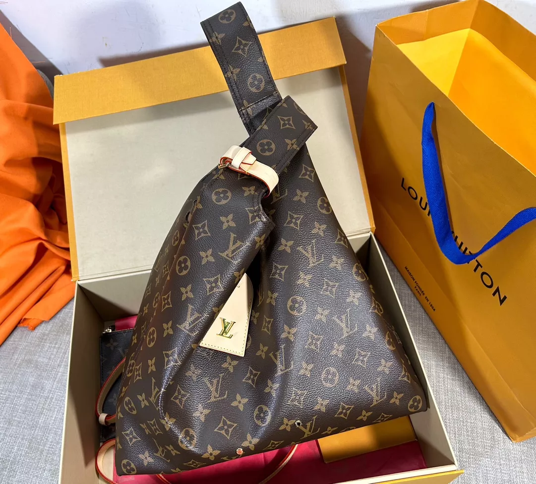 Louis Vuitton Atlantis GM in Coated Canvas with Gold-tone