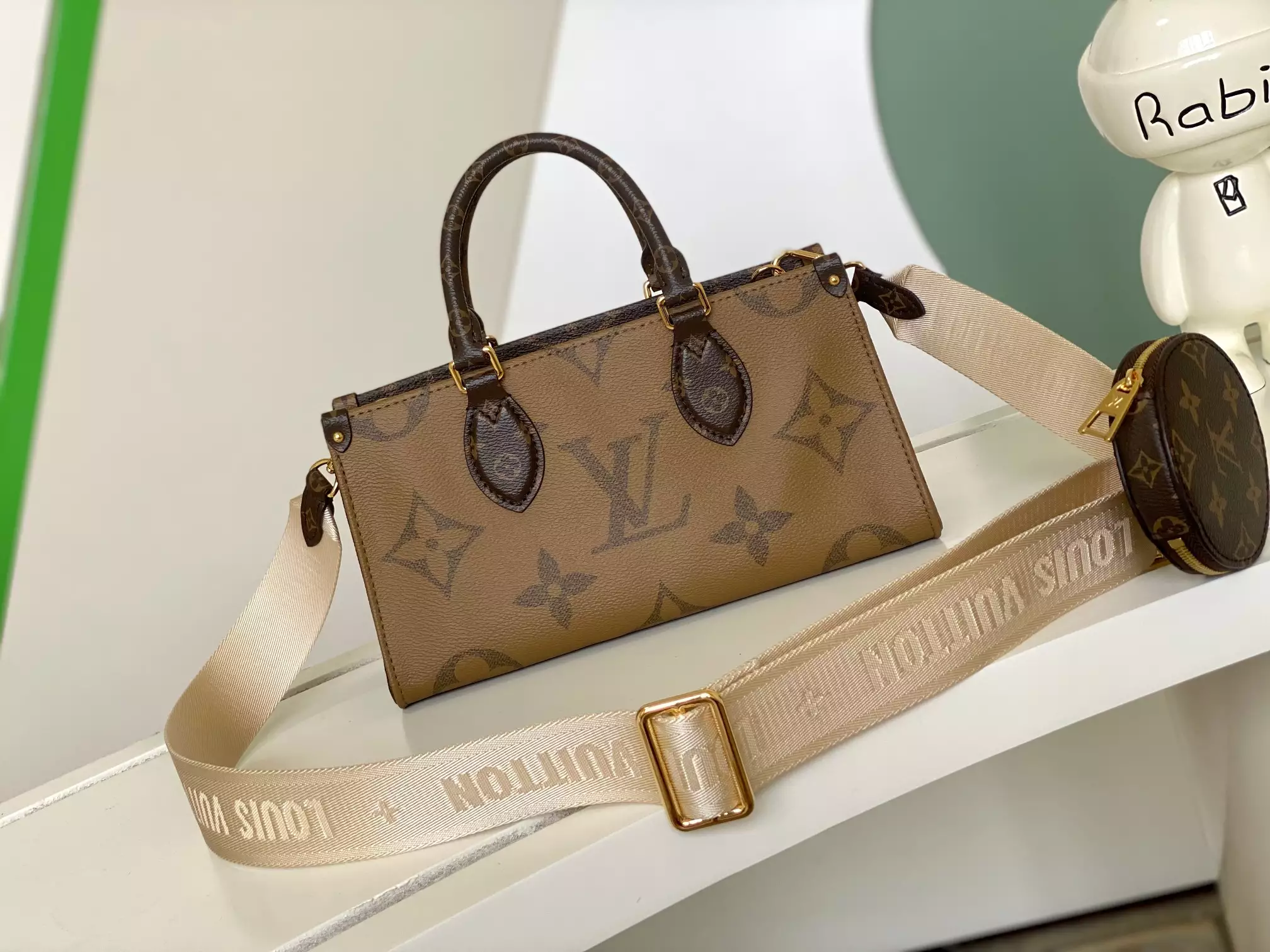 Onthego East West Monogram Reverse Brown Latte