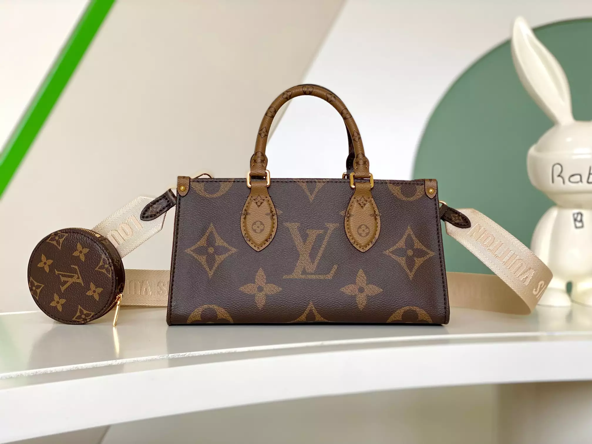 Onthego East West Monogram Reverse Brown Latte