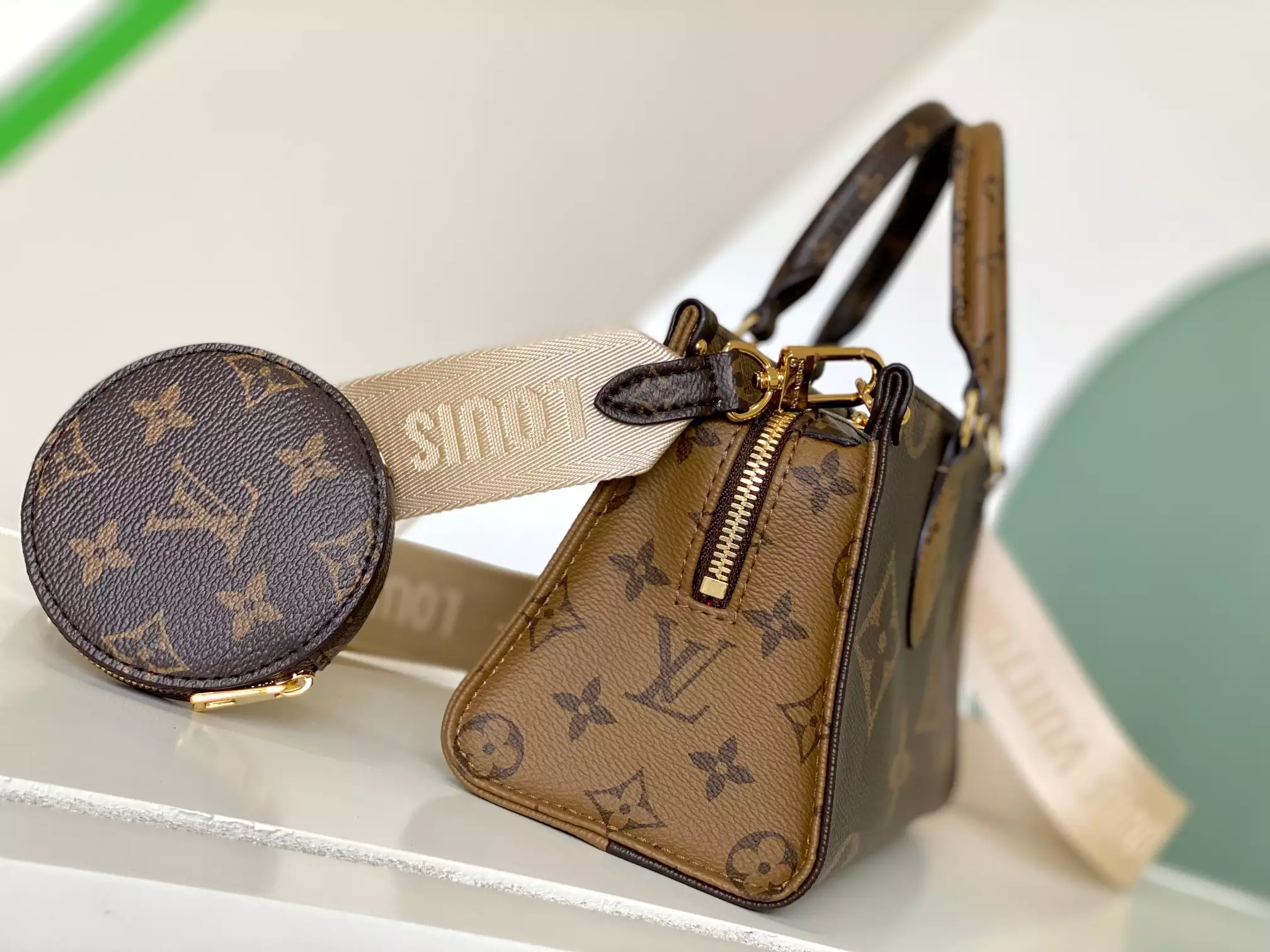 Onthego East West Monogram Reverse Brown Latte