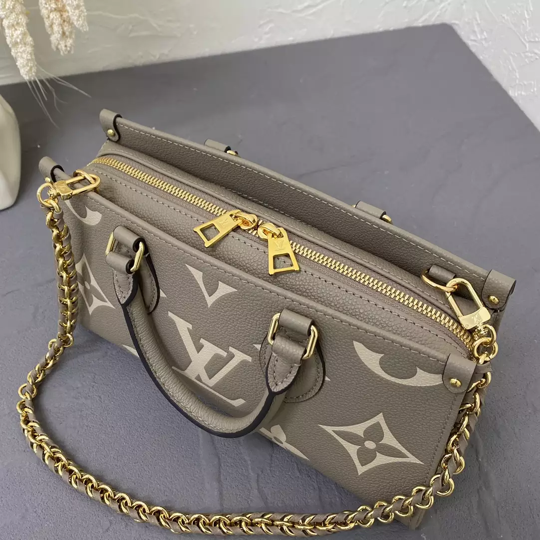 OnTheGo East West Bicolor Monogram Empreinte Dove Gray/Cream Leather