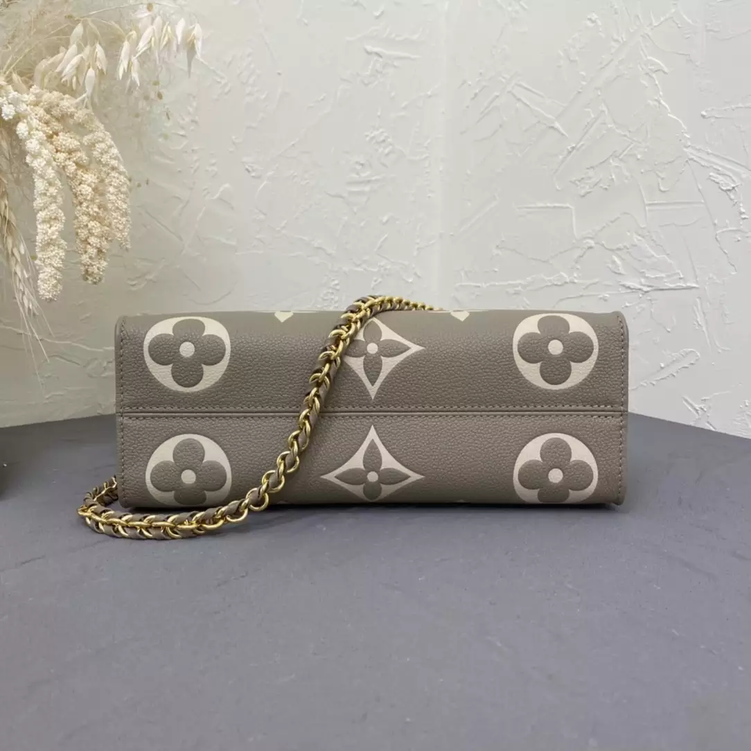OnTheGo East West Bicolor Monogram Empreinte Dove Gray/Cream Leather
