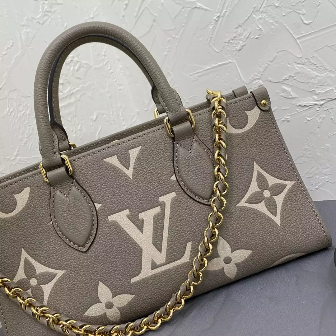 OnTheGo East West Bicolor Monogram Empreinte Dove Gray/Cream Leather