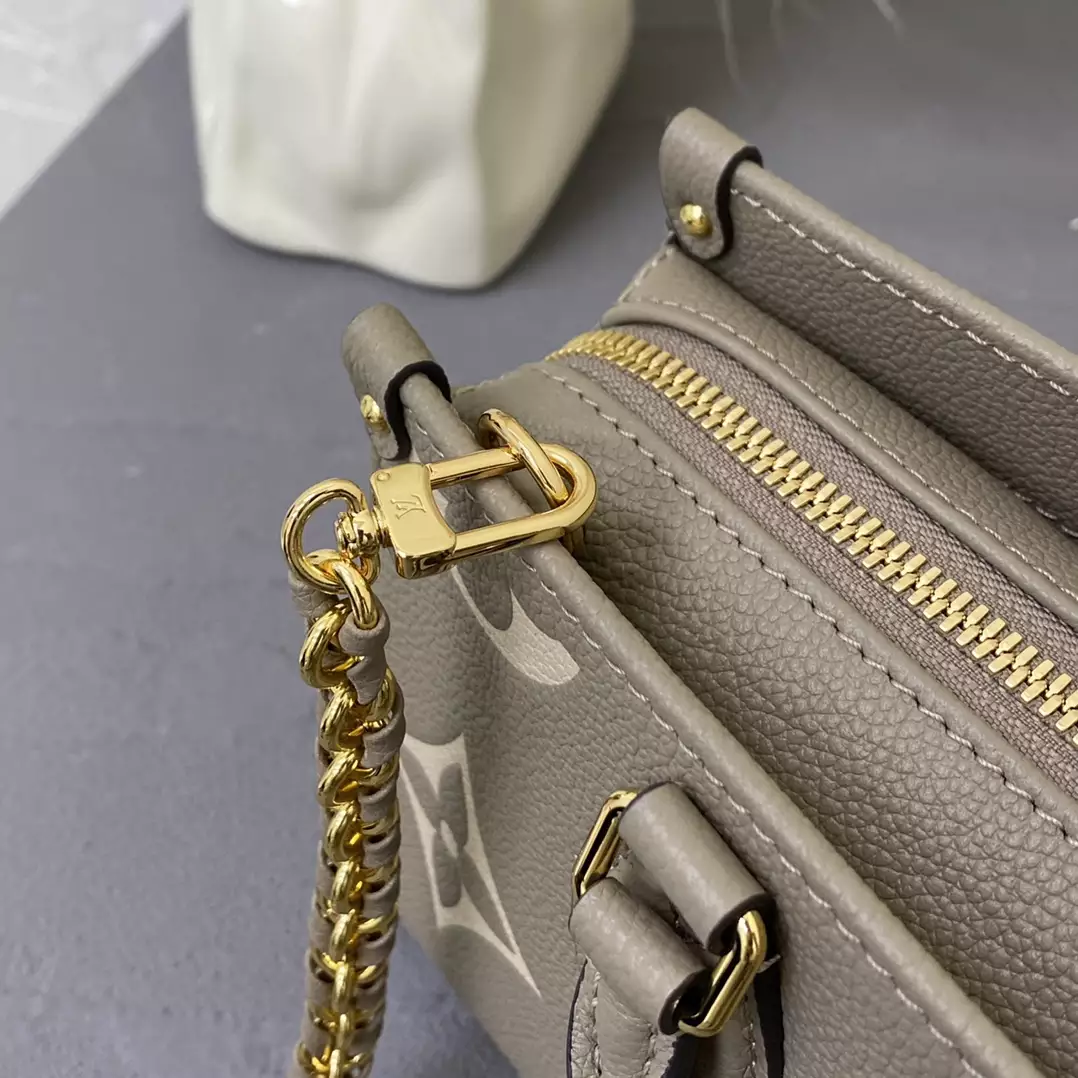 OnTheGo East West Bicolor Monogram Empreinte Dove Gray/Cream Leather