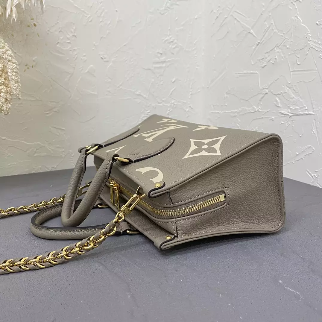 OnTheGo East West Bicolor Monogram Empreinte Dove Gray/Cream Leather