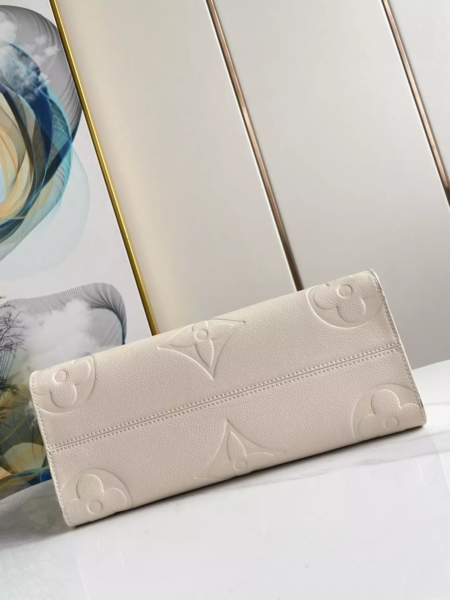 OnTheGo MM Monogram Empreinte Cream Leather