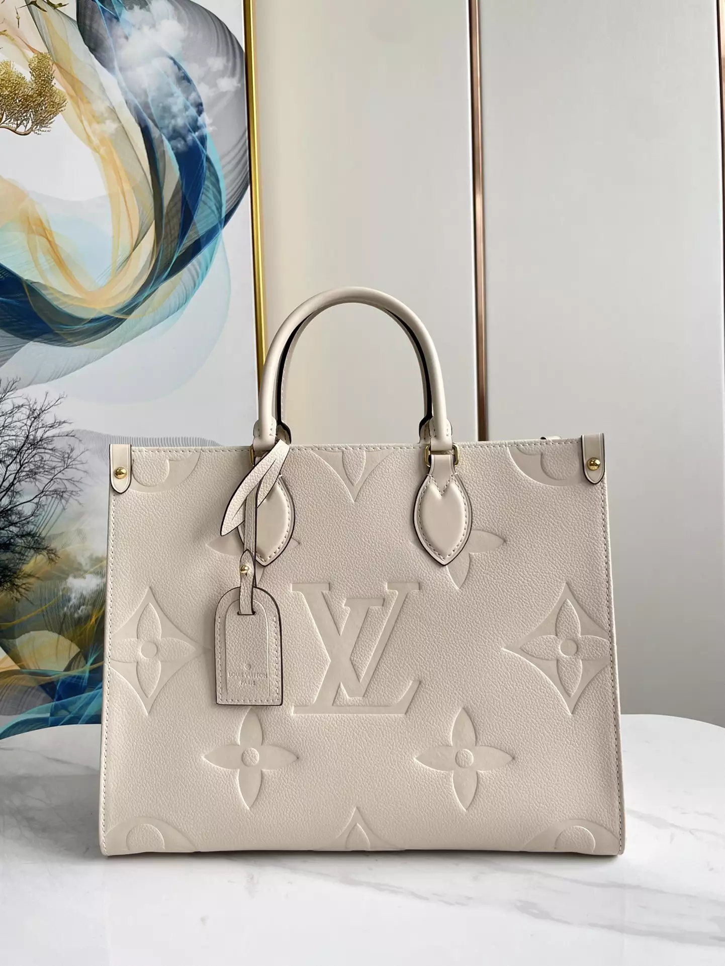 OnTheGo MM Monogram Empreinte Cream Leather