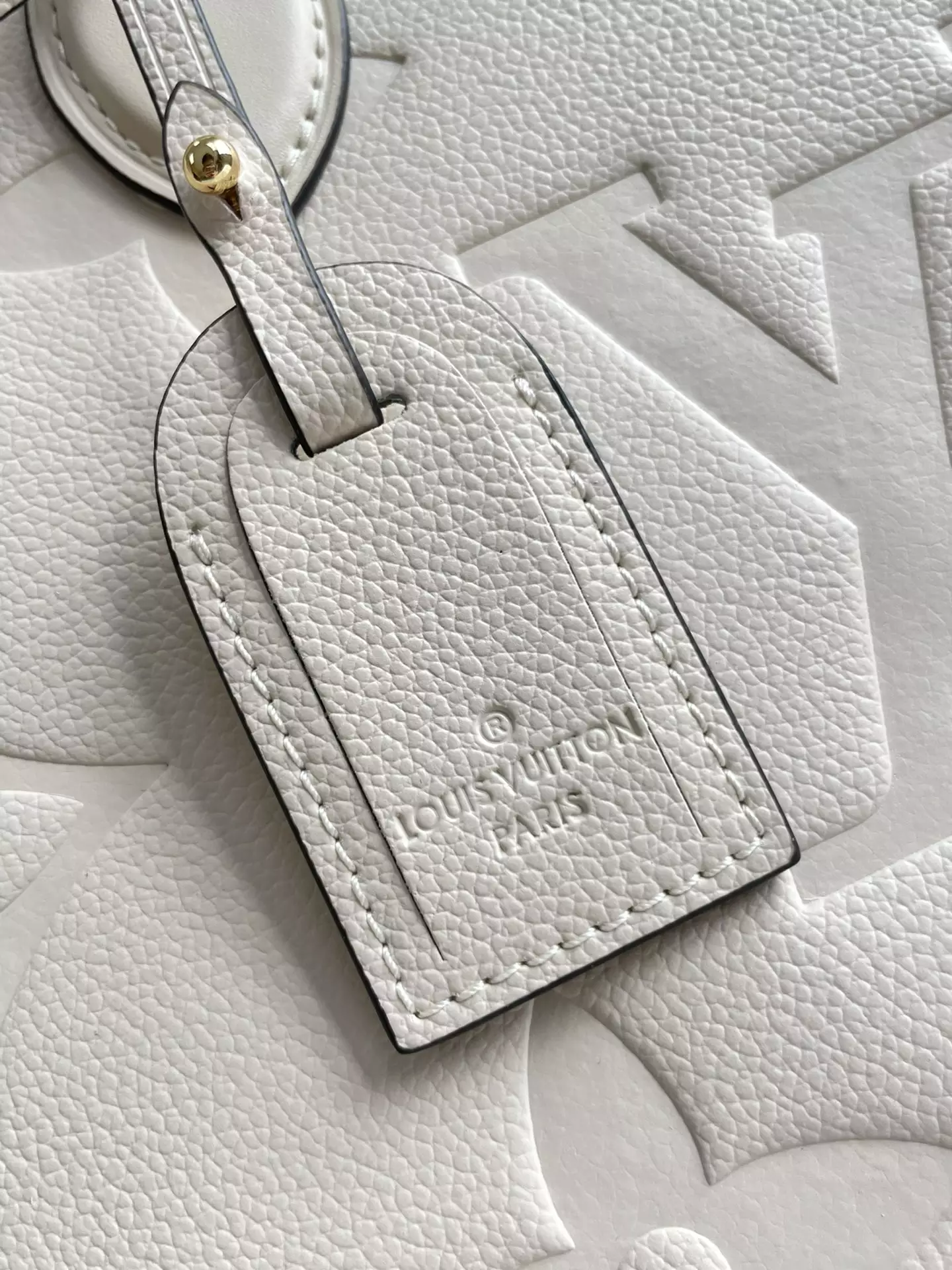 OnTheGo MM Monogram Empreinte Cream Leather