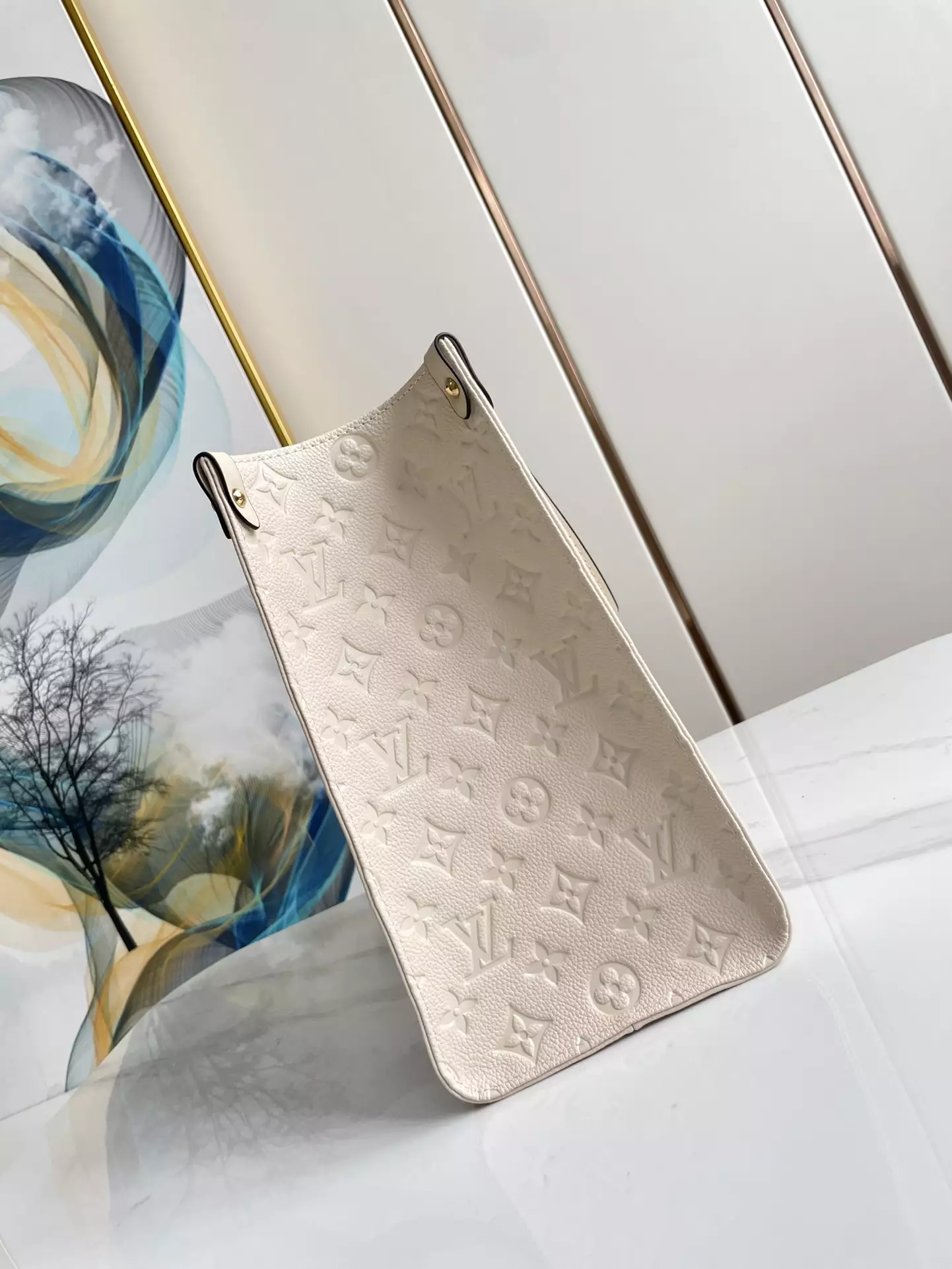 OnTheGo MM Monogram Empreinte Cream Leather