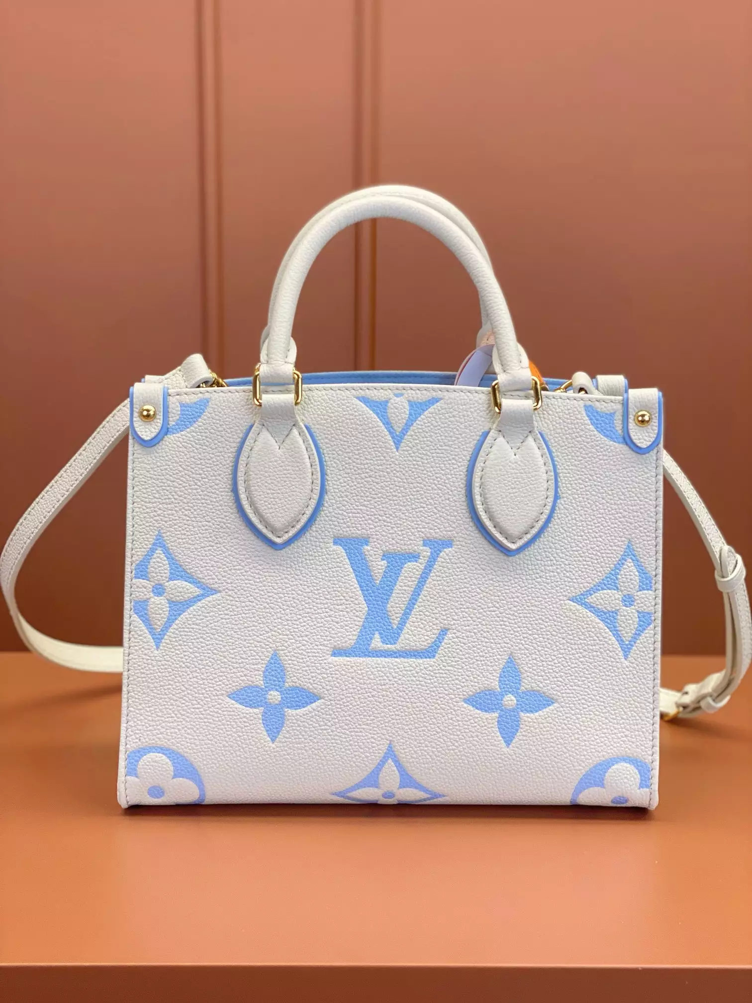 OnTheGo PM Bicolor Monogram Empreinte Latte/Candy Blue Leather
